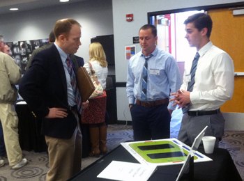 Andrews and Fier present their soccer idea.